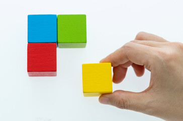 Hand to building wooden cube puzzle