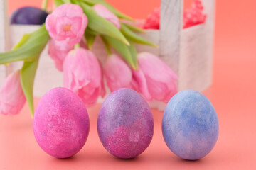 Beautiful pink tulips, rabbit toy  Wooden box white. Pink background. Concept illustration of Easter, holiday. Greeting card. Close-up