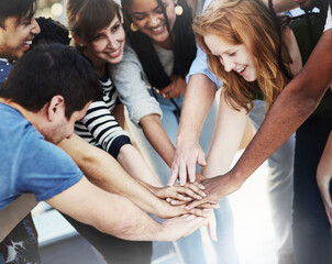 Obraz premium As a team. Cropped shot of unrecognizable businesspeople coming together as a team.