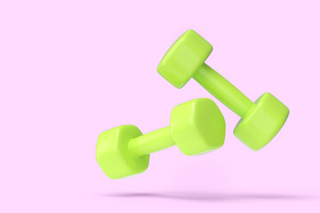 Pair of rubber green dumbbells isolated on pink background