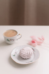 Good morning banner. Cup of coffee and homemade dessert zephyr. Top view. Food Photography with copy space. A cup of coffee and an airy marshmallow. Culinary background