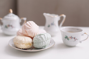 Good morning banner. Cup of coffee and homemade dessert zephyr. Top view. Food Photography with copy space. A cup of coffee and an airy marshmallow. Culinary background
