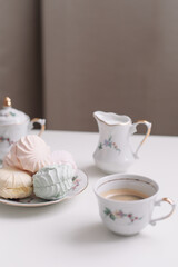Good morning banner. Cup of coffee and homemade dessert zephyr. Top view. Food Photography with copy space. A cup of coffee and an airy marshmallow. Culinary background