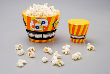 Colorful set of ceramic bow, with popcorn, and salt dispenser, isolated