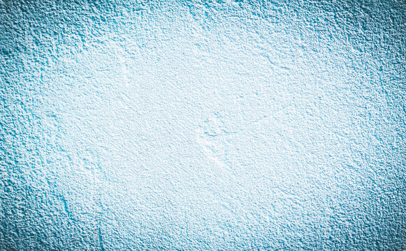 whitr blue textured horizontal cement background with vignette. 