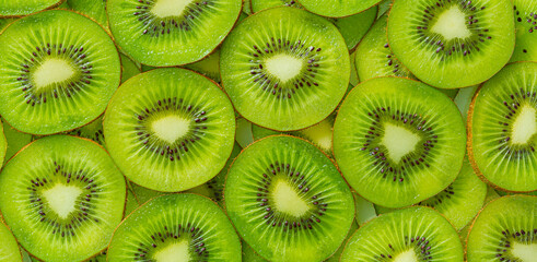 Kiwi Macro,Fresh Kiwi fruit sliced use for background,slice of kiwi fruit on a full frame. horizontal format - obrazy, fototapety, plakaty