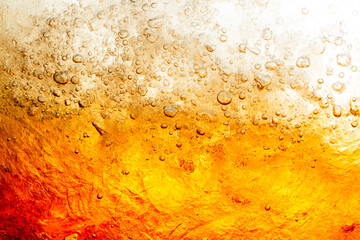 macro soft drink texture,Close up view of the ice cubes in dark cola background. Texture of cooling sweet summer's drink with foam and macro bubbles on the glass wall.