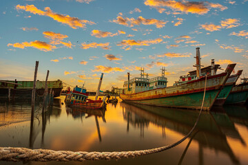fishing boats and the evening sky,Fishing trawler at sunset,Main port for travel ship to krabi and...