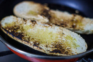 Bread with oil and toasted in a pan.