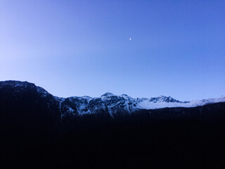 High mountains, glacier in the blue sky background 