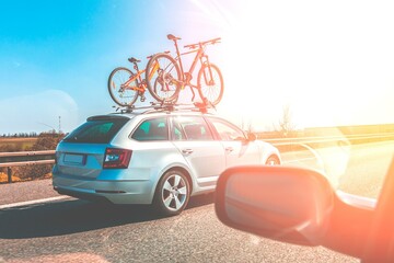 Bicycle roof mount. Transportation of mountain bikes on the roof of the car. Car with two bicycle...