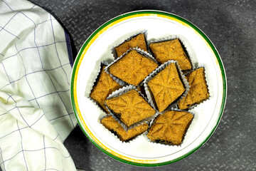 Fried Makrout - Algerian semolina, dates and honey sweets, traditional North Africa sweet food for islam holidays like Ramadan and Eid 