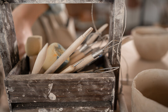 modeling tools in a wooden box. Pottery, ceramic art concept.