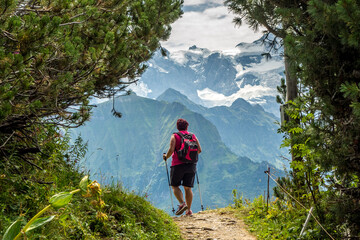 Walking near Schynige Platte in the Bernese Alps Switzerland - 495757164