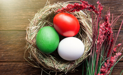 Fototapeta na wymiar Happy Easter holiday card, Easter eggs as the color of the Italian flag red, white, green. 
