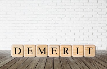 Wooden Cubes form a word. Business and demerit concept.