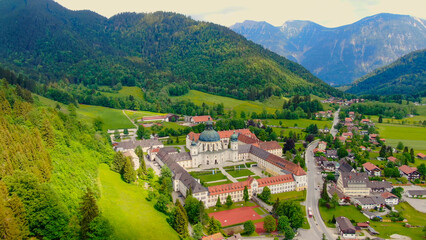 Ettal Abbey, called Kloster Ettal, a monastery in the village of Ettal, Bavaria, Germany - aerial...