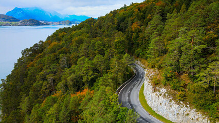 Panoramic street along Lake Thun in Switzerland - aerial drone footage at Beatenbucht