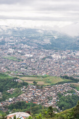 view of the city of Pereira-Colombia from the top of the mountain. urban area bordering the...