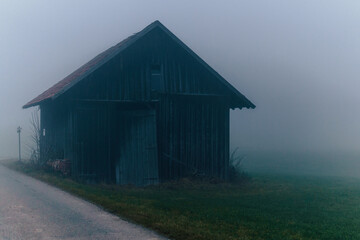 View of an abandoned house in Allgovia on a foggy day