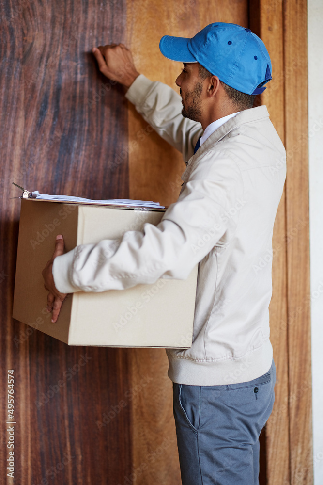 Poster knock knock. shot of a delivery man delivering a box to a customers door.