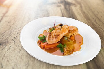 Roast chicken meat with vegetable on plate