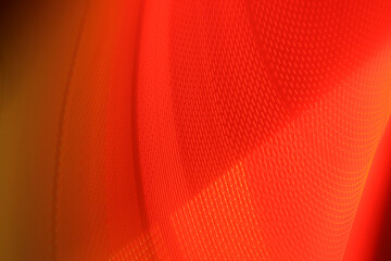 Reddish-orange pattern of electrons gaining energy and performing accelerated motion