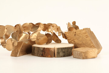 Wooden eco rustic wood circle disc platform podium and leaf twig on light background. Minimal empty display product presentation scene.
