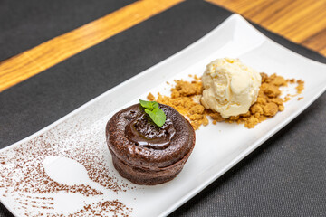 Closeup shot of chocolate fondant with vanilla ice-cream