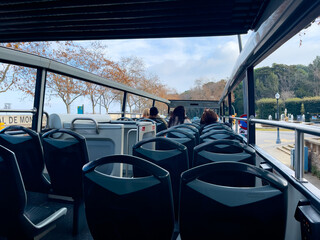 Few tourists taking a ride on a tour bus in Barcelona © Mounir