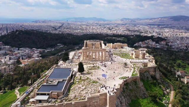 Aerial drone video of iconic Acropolis hill and the Parthenon a Unesco World Heritage Masterpiece of ancient times, Athens historic centre, Attica, Greece