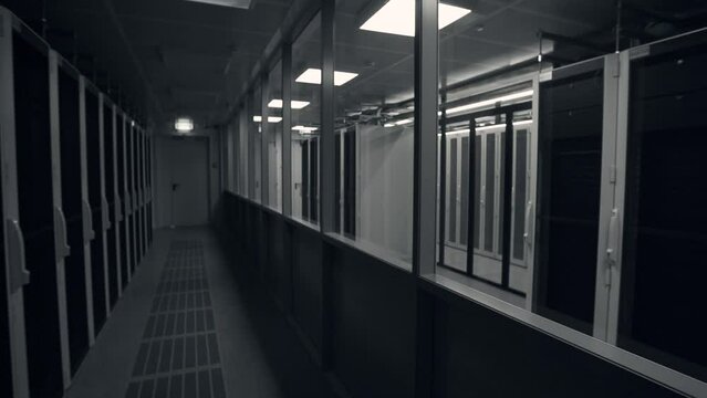 Shot of Corridor in Working Data Center Full of Rack Servers and Supercomputers with High Internet Visualisation Projection. IT sector, technologies concept