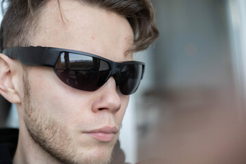 man in smart glasses with camera scanner. Covert video surveillance glasses for espionage