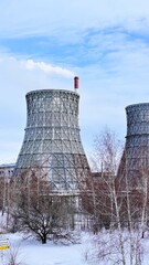Gas combined heat and power plant with huge pipes, smoke, steam, power stations.