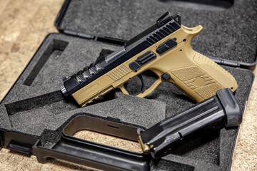 Modern traumatic pistol. Non-lethal short-barreled weapon for self-defense. Light back.