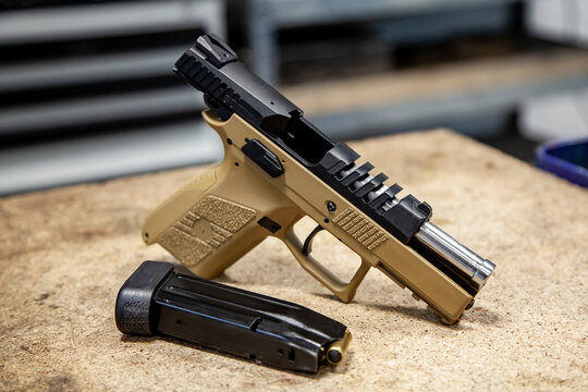 Modern traumatic pistol. Non-lethal short-barreled weapon for self-defense. Light back.