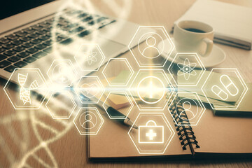 Double exposure of DNA drawing and desktop with coffee and items on table background. Concept of...