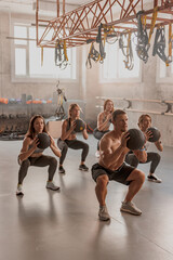 Shot of fitness group having workout session at gym - obrazy, fototapety, plakaty