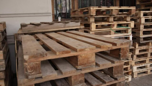 Wooden pallet front, angle view. Wood trays for cargo loading, transportation. Freight delivery, warehousing service equipment. Shipment in logistics and transportation industrial, wood pallets stack.