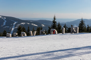 Medvedin, wooden letters at the top of the ski resort Medvedin in mountain Krkonose, the most popular Czech ski resort Spindleruv Mlyn. Czech Republic