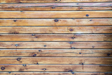 Obraz premium Wooden surface with horizontal planks with small swirls. Natural background.