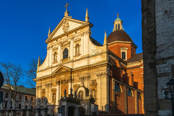 Church of Saints Peter and Paul in Krakow at sunset in the rays of the evening sun against the blue sky in spring, side view