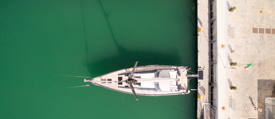 Aerial drone photo of a sail boat in the ope sea