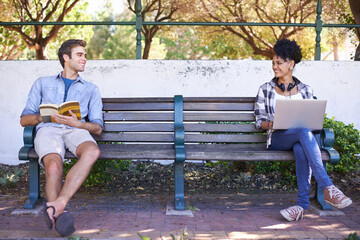 Noticing each other for the first time. Two students sitting on opposite sides of a bench with...