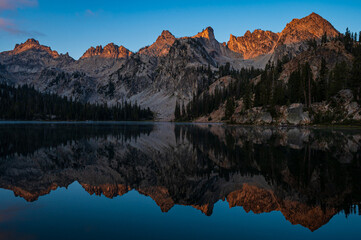 Mesmerizing view  of the reflection of the Sawtooth Mountains in the  Alice Lake