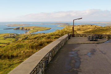 Beautiful nature scene of Sky Road in county Galway, near Clifden town. Ireland. Car park and metal sign. Nobody. Warm sunny day. Popular tourist viewpoint with amazing view on Irish Nature