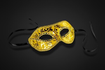 Carnival masquerade concept. Luxury venetian mask on dark background.