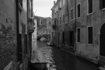 Old narrow canals with gondolas in Venice, Italy