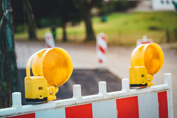Selective focus shot of traffic management barriers in front of a construction site