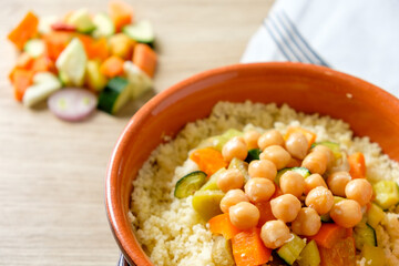 vegan cous cous vith chickpeas and vegetables, traditional dish of north africa